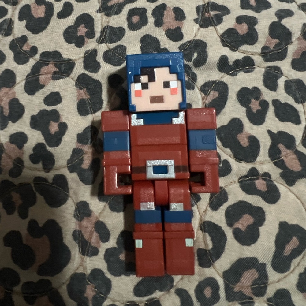 Pixelated Action Figure - Red and Blue